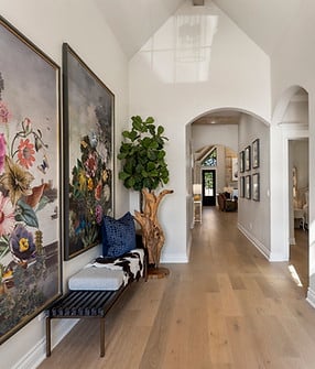 A hallway with a large wall painting