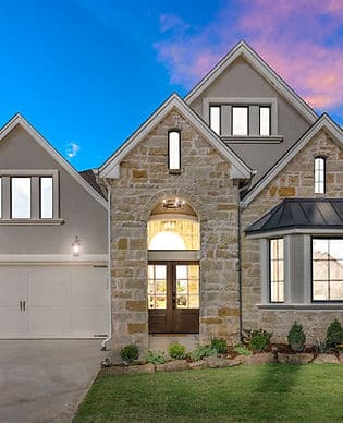 A large house with a stone and brick exterior